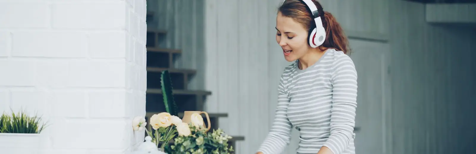 Woman in gloves cleaning a kitchen bench — cleaning tips and guides from Fizzy Cleaning Auckland