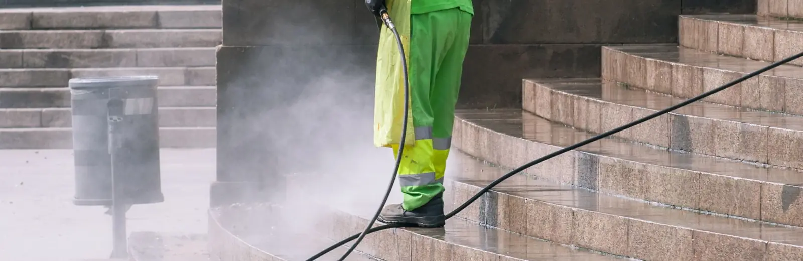 Pressure washing exterior steps and paving during an Auckland exterior house clean